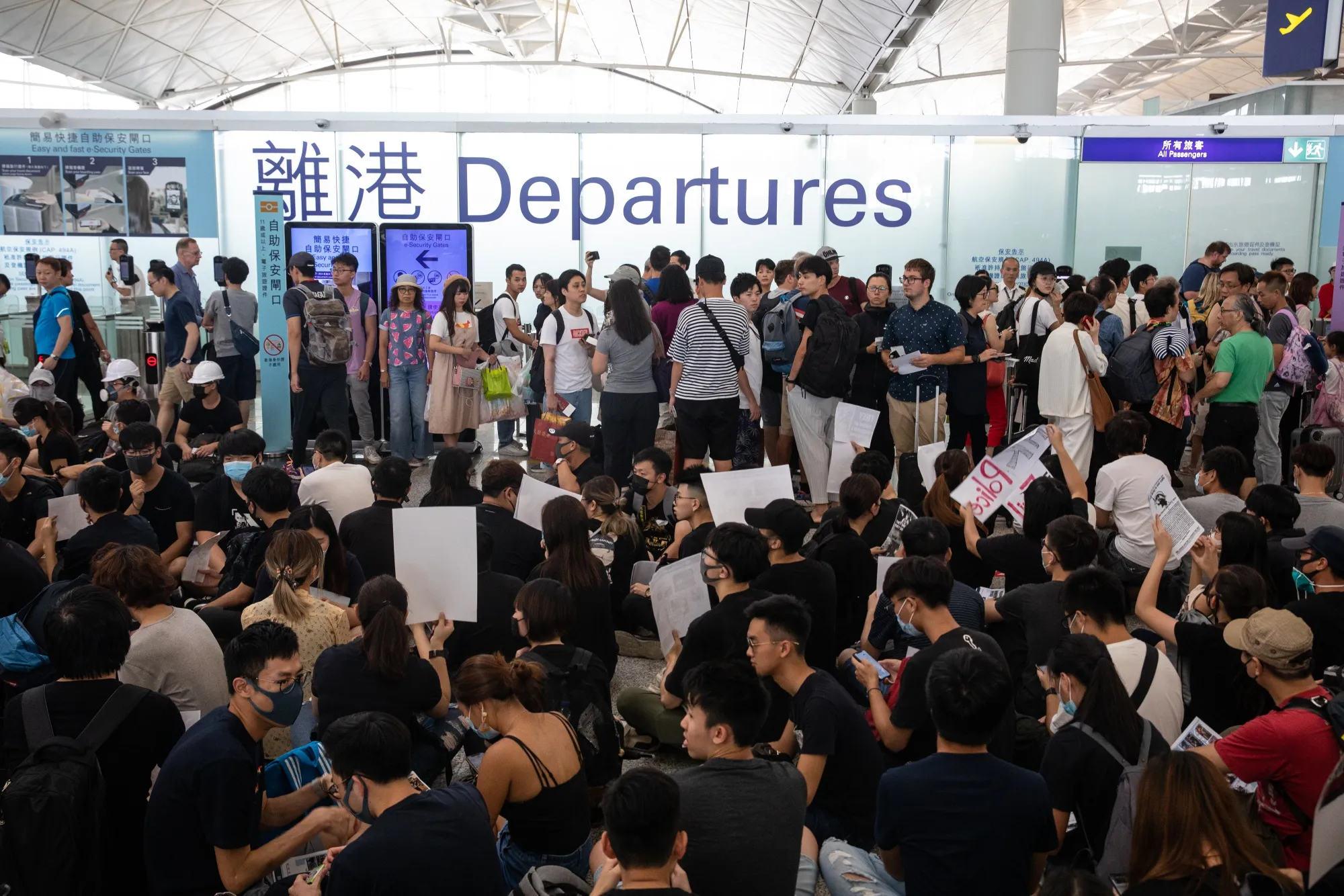 Demonstrators stage a sit-in at the Hong Kong International Airport on Aug. 12.