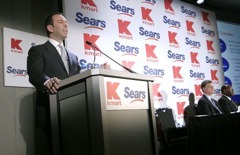 Lampert speaking during a news conference announcing the merger of Kmart with Sears in 2004.