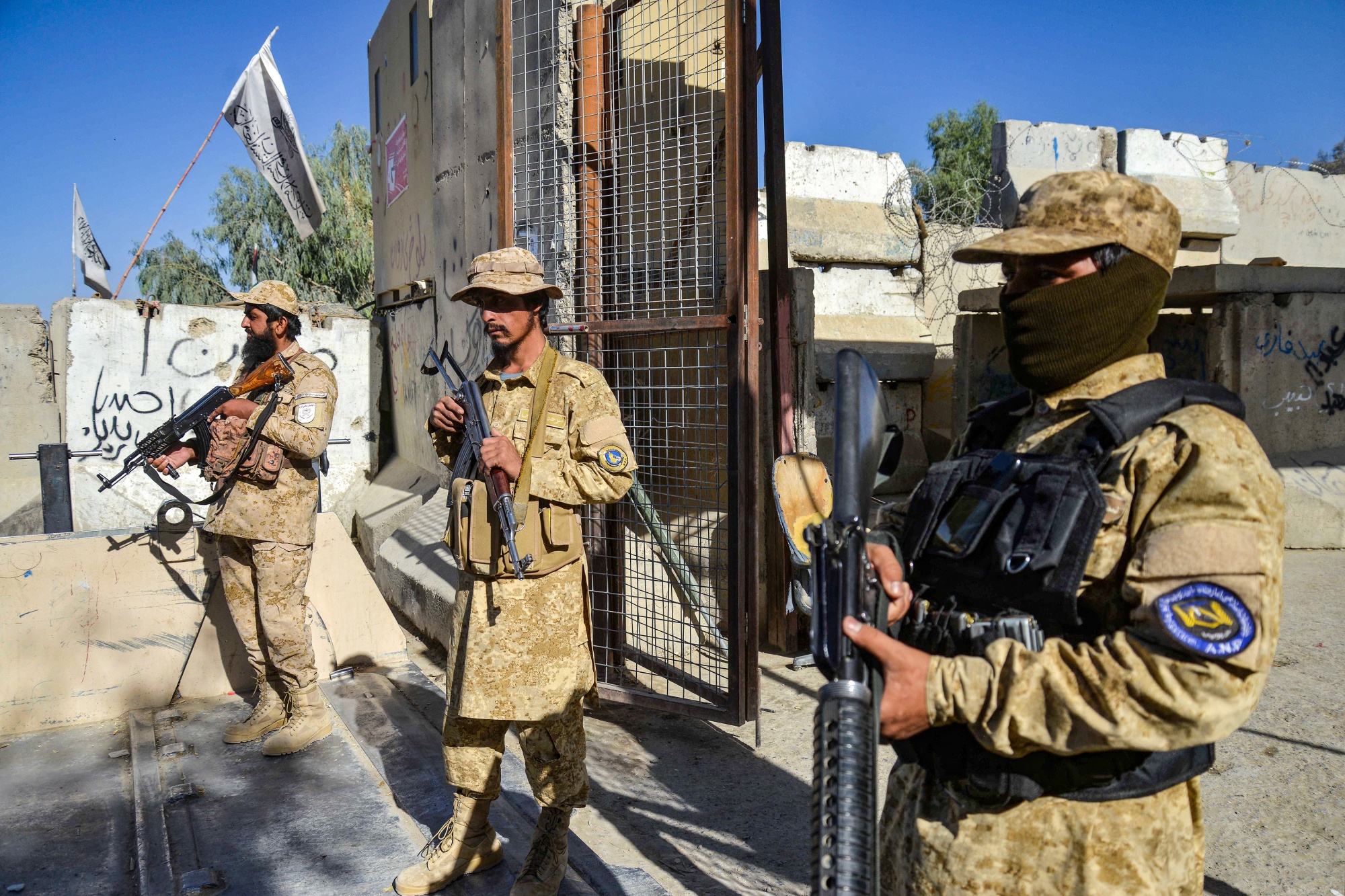 Armed Taliban security personnel keep guard at the zero point border crossing between Afghanistan and Pakistan at Spin Boldak district in Kandahar province on Oct. 12. Photographer: Sanaullah Seiam&#x2F;AFP&#x2F;Getty Images