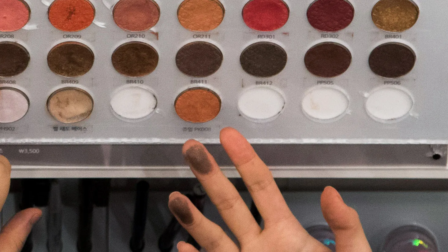 Customers browse eyeshadow pallets at an Amorepacific Corp. Etude House store in the Myeongdong shopping district in Seoul, South Korea, on Monday, Feb. 16, 2015. AmorePacific Corp., South Korea’s largest cosmetics maker, joins companies such as Hotel Shilla Co. and casino operator Paradise Co. in benefiting from the rising popularity of Korean entertainment and culture, especially in China.

