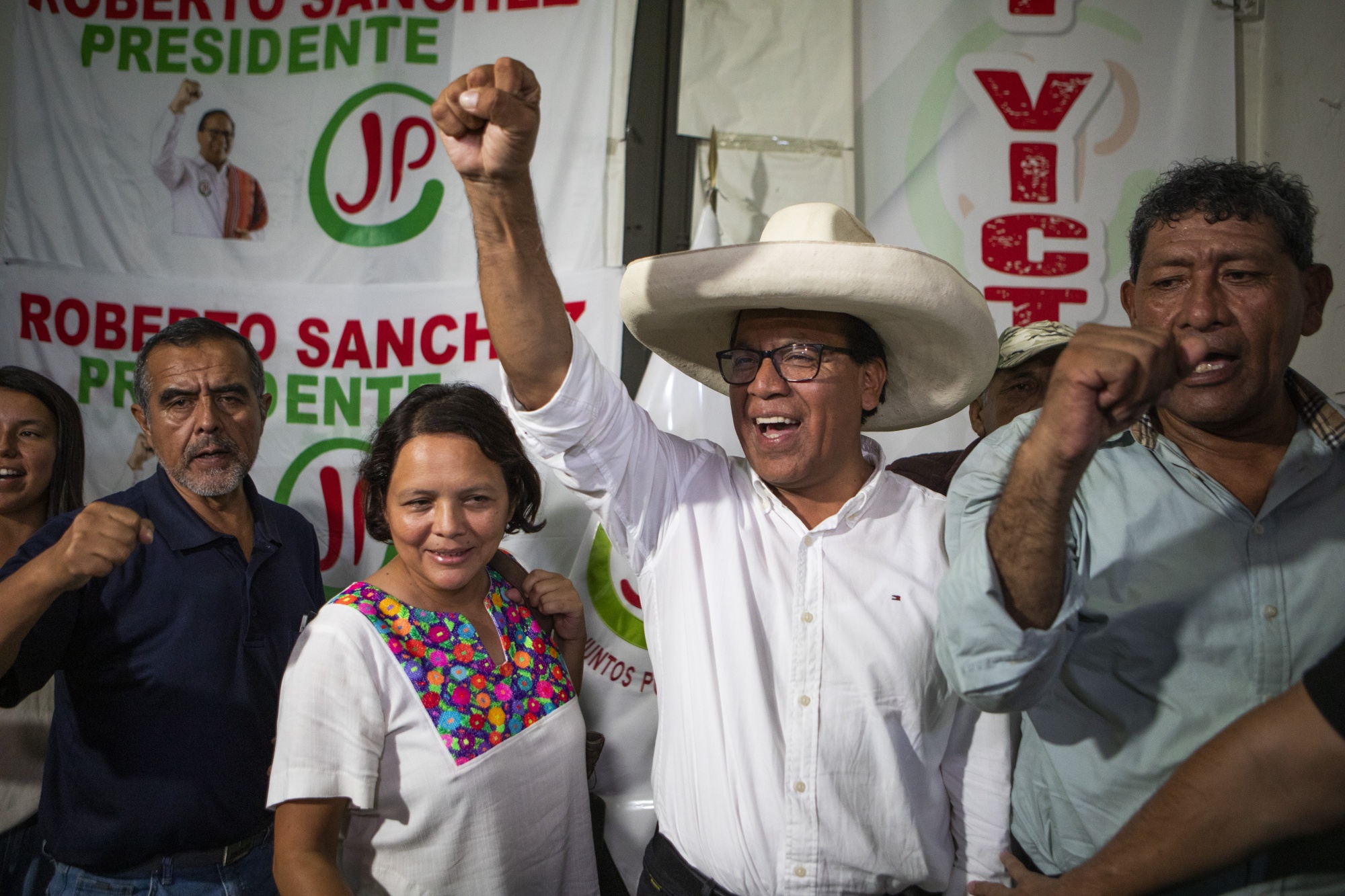 Roberto Sanchez, presidential candidate for the Together for Peru party, center, during a news conference at the party's headquarters in Lima, Peru, on Sunday, April 12, 2026. The lack of a clear opponent against the Popular Force party's Keiko Fujimori means it’s still uncertain whether Peru’s runoff will feature two candidates from the right or become a more ideological battle with a leftist rival. Photographer: Marco Garro/Bloomberg