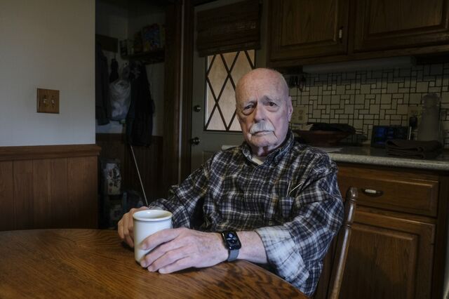 Charlie Hutchens sits at his kitchen table at his home. 