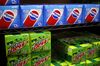Cases of PepsiCo Inc. Pepsi brand soda and Mountain Dew brand soda are displayed for sale inside a convenience store in Bagdad, Kentucky, U.S., on Sunday, Feb. 11, 2018. PepsiCo Inc. is scheduled to release earnings figures on February 13.