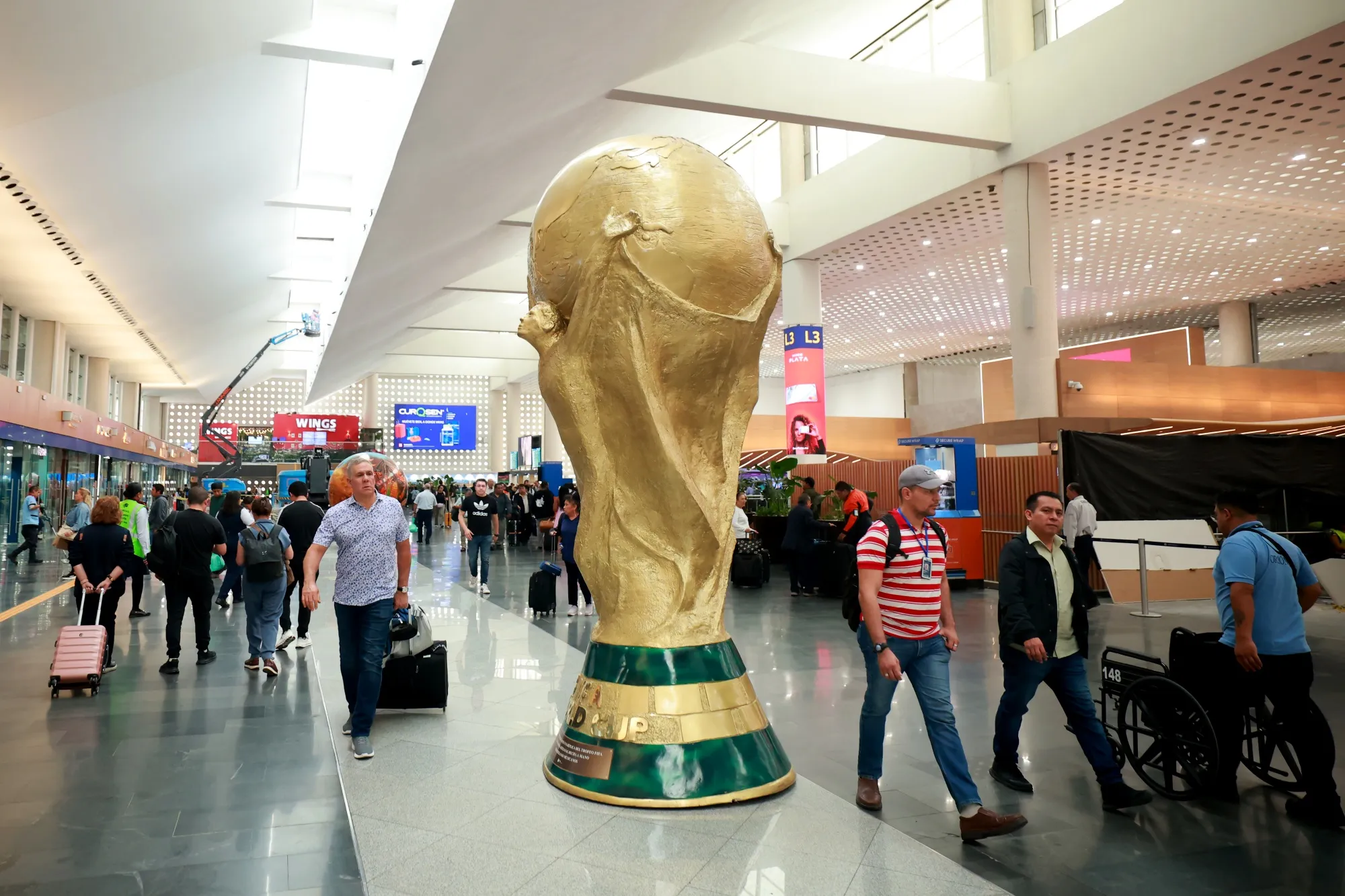 A FIFA World Cup trophy sculpture at Benito Juarez International Airport in Mexico City.