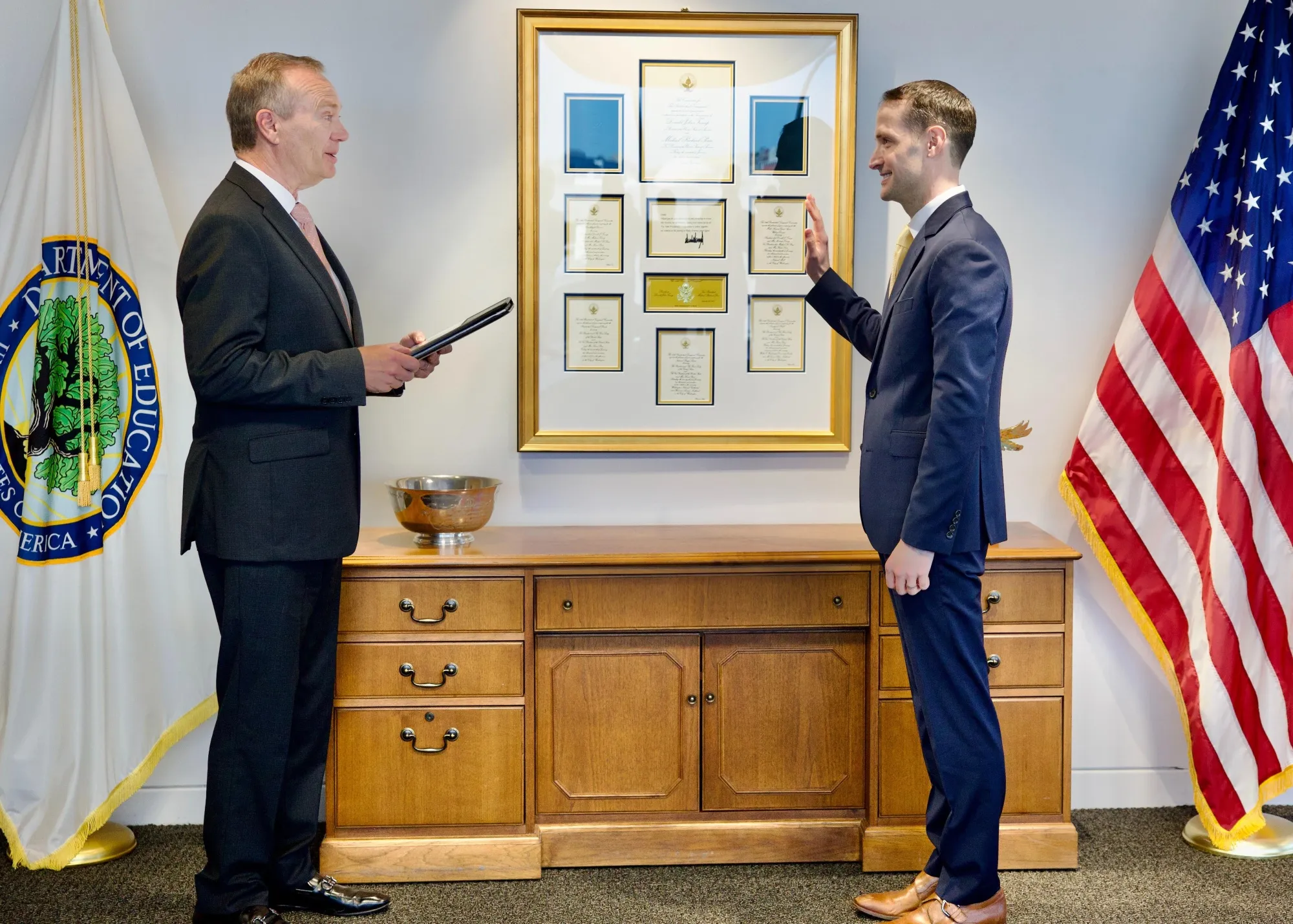 Nicholas Kent (right) sworn in as under secretary of education in August.