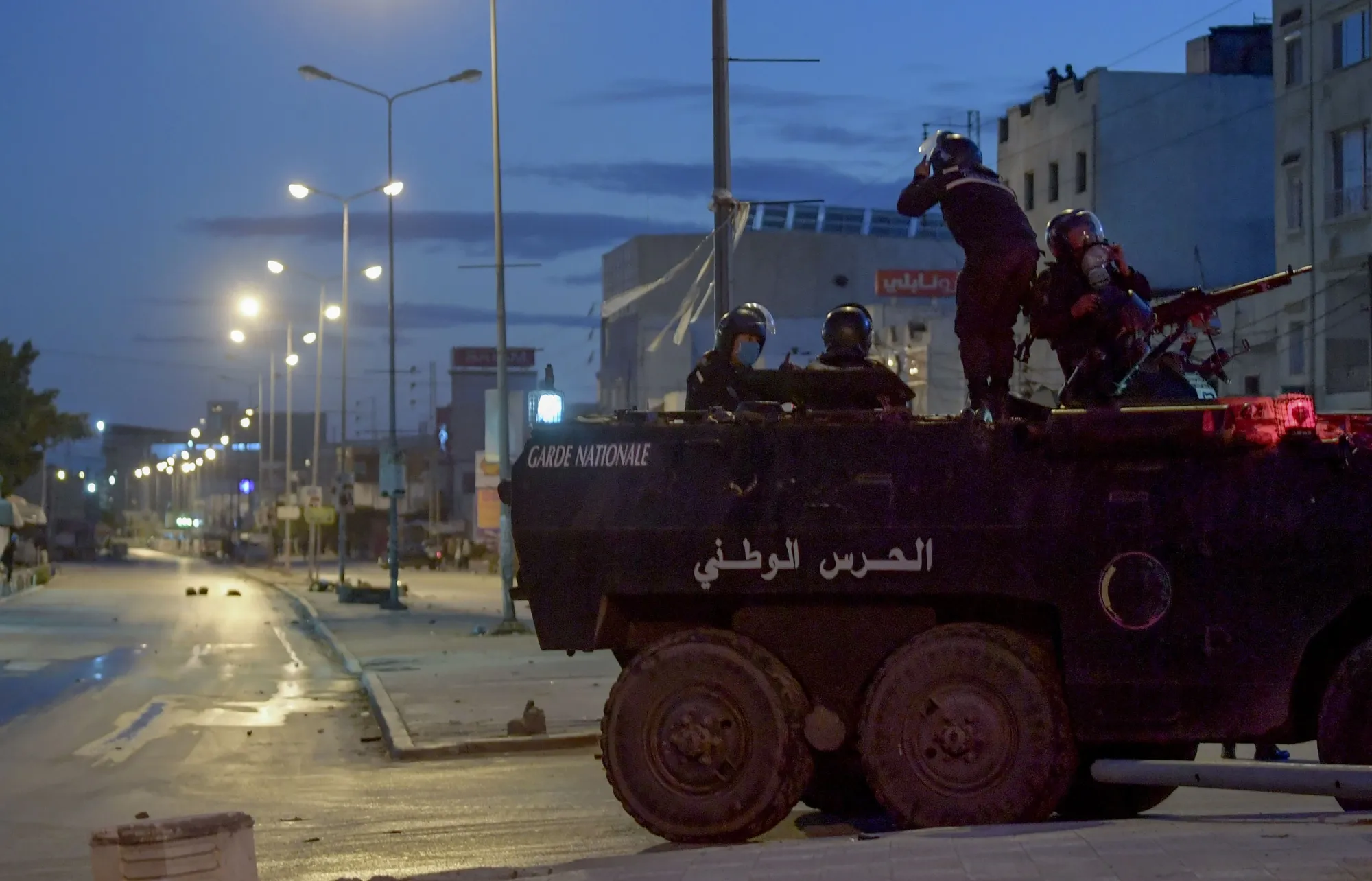 Members of the Tunisian National Guard on their armoured vehicle, following a protest in&nbsp;Tunis, on Jan. 17.