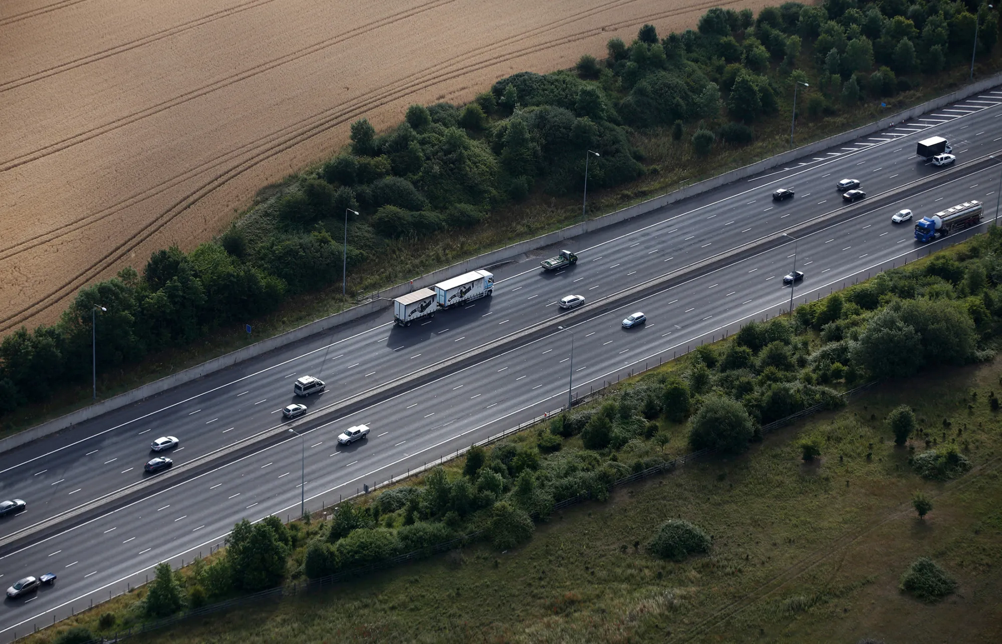 Traffic travels along the M25 motorway in this aerial photograph taken near Upminster, U.K.
