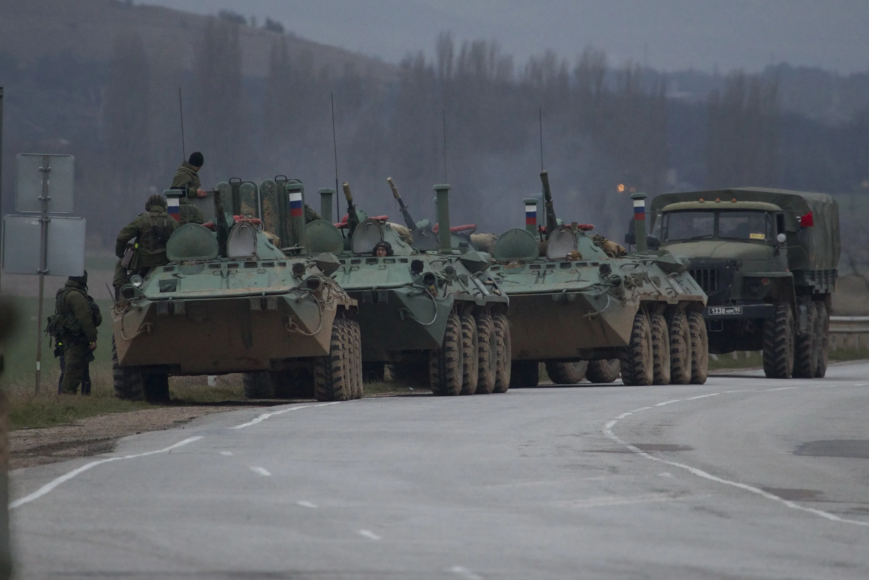 Russian armored personnel carriers and a truck are parked near the town of Bakhchisarai, Ukraine on Feb. 28, 2014.
