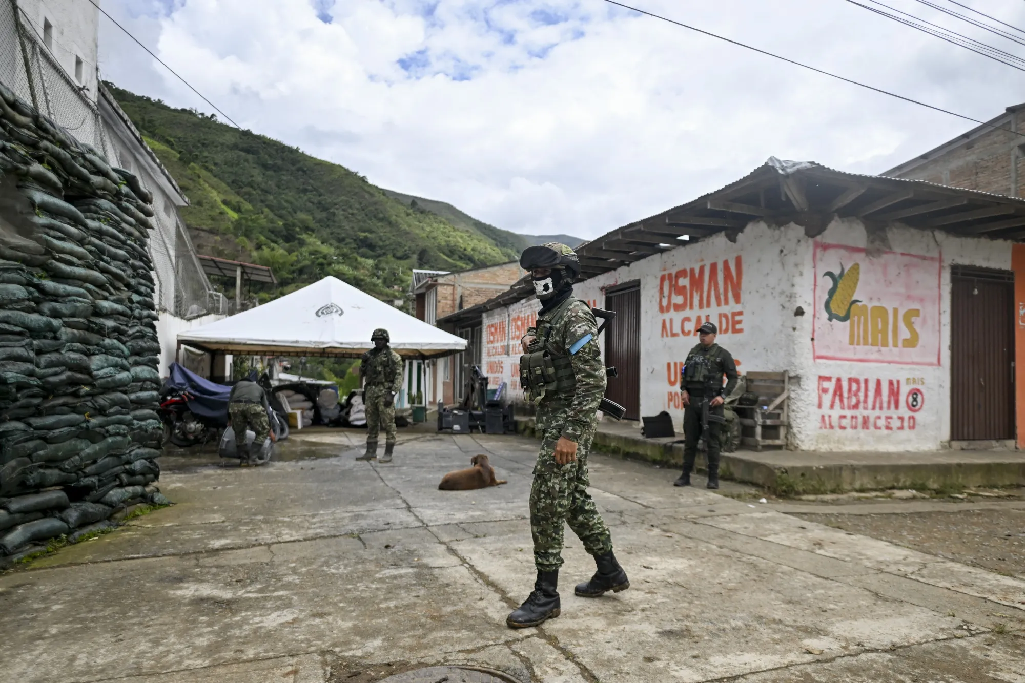 Colombian soldiers and policemen stand guard in Argelia, Colombia, in May.