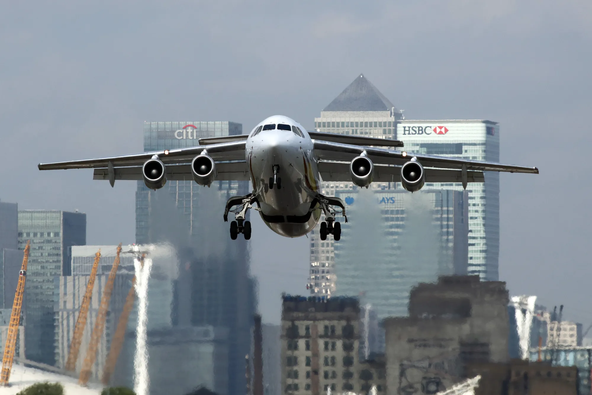 A passenger aircraft takes off from London City Airport.