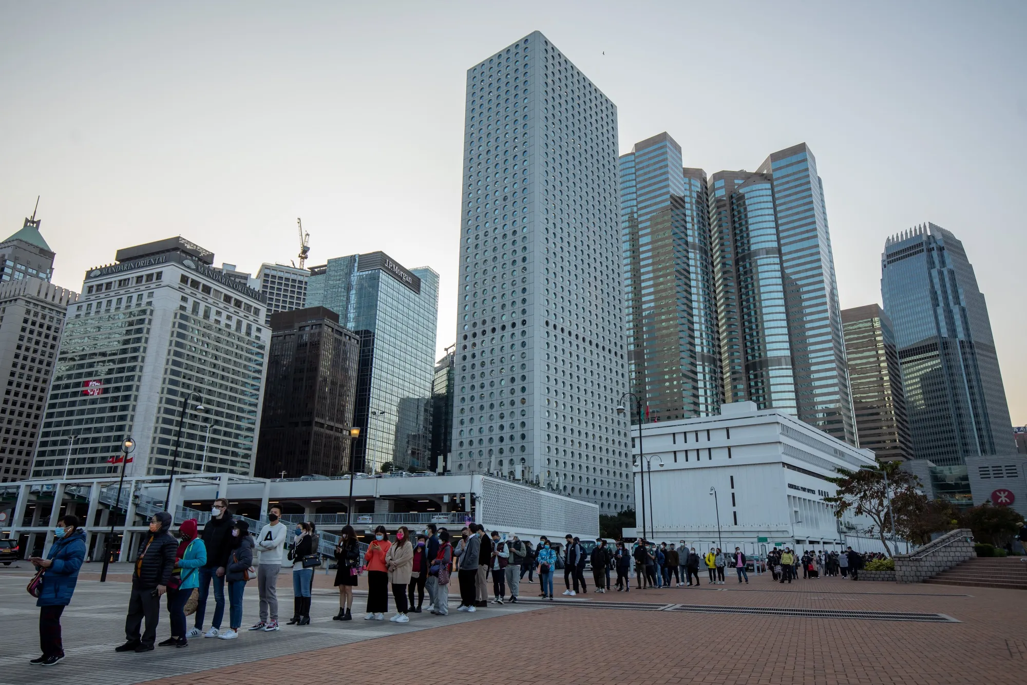 Members of the public stand in line for a Covid-19 test in the Central area of Hong Kong on Feb. 4.