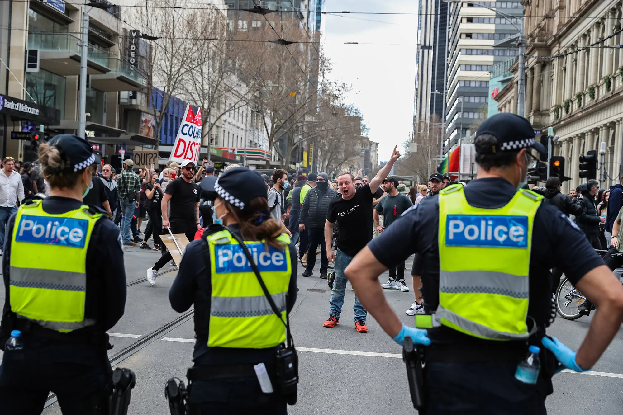 Protesters confront police officers&nbsp;in Melbourne, on Aug. 21.&nbsp;
