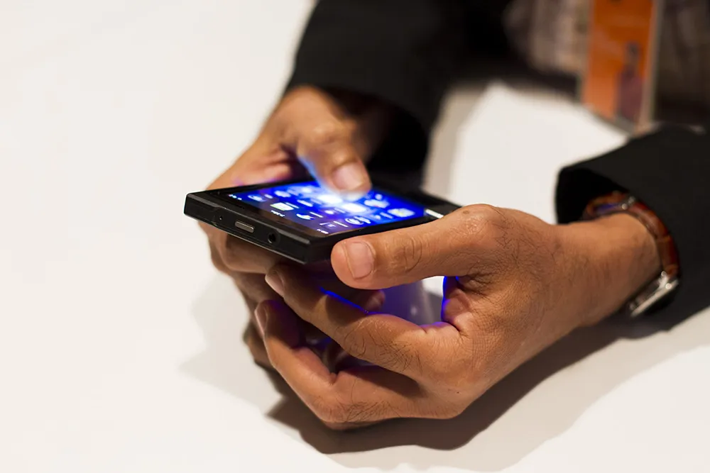 A man tries a Research In Motion Ltd. (RIM) BlackBerry 10 smartphone prototype at the BlackBerry Jam Asia developer conference in Bangkok, Thailand. Photographer: Brent Lewin/Bloomberg