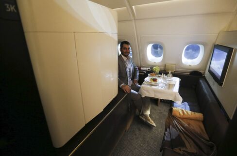 A journalist sits in one of the first class "Apartments" on the Etihad Airways Boeing B787.