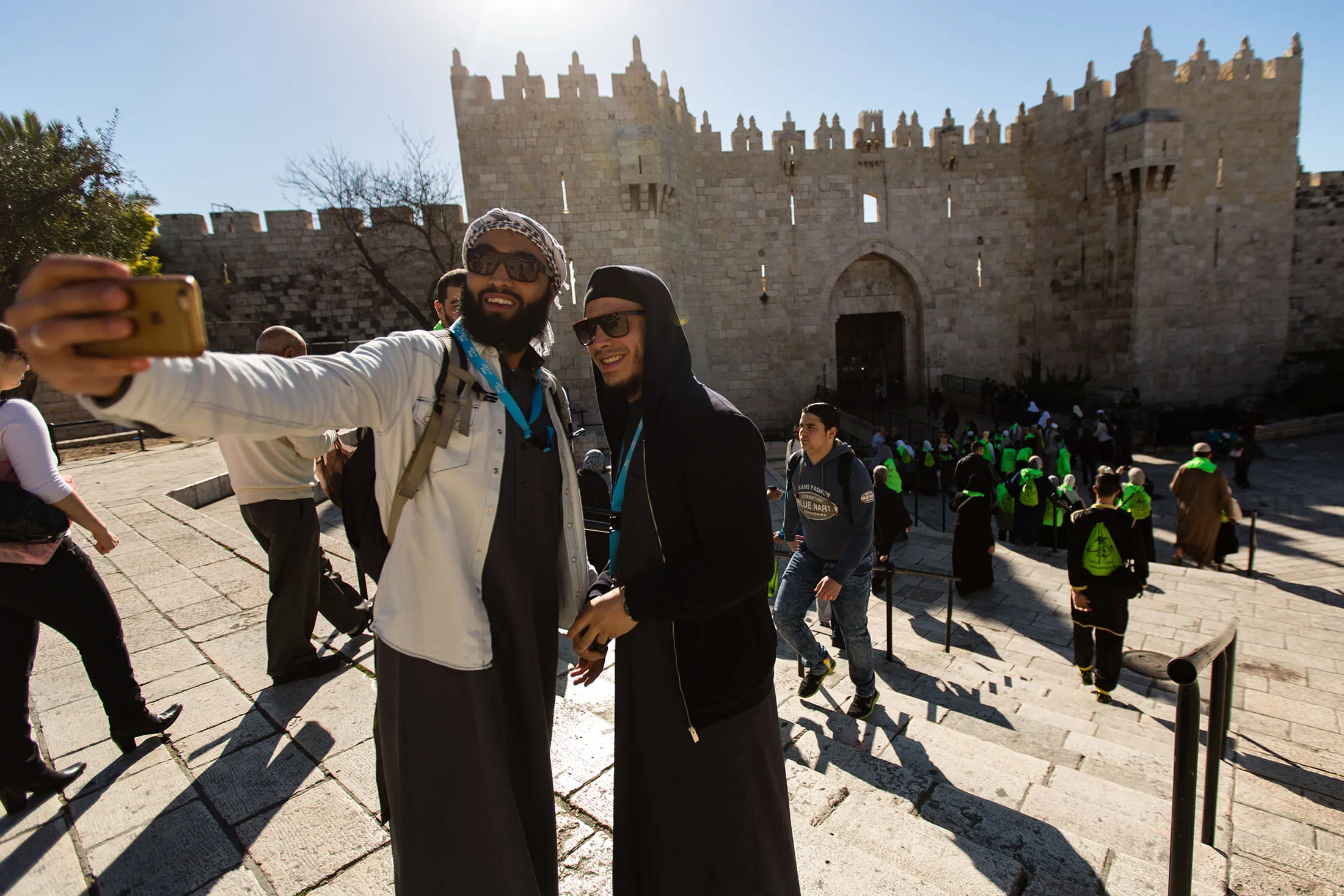 Muslim tourists pose for a selfie in front of Damascus Gate, in the Old City of Jerusalem.
