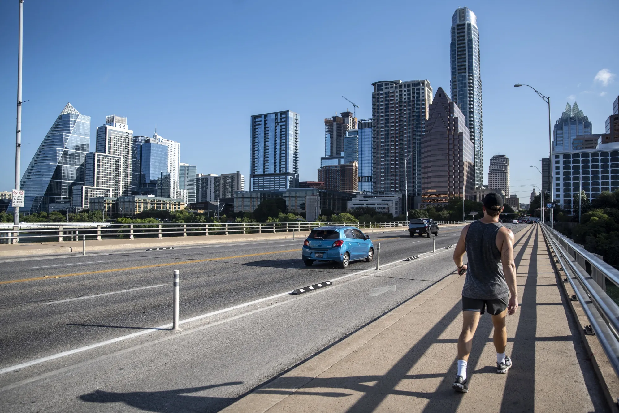 A pedestrian crosses a bridge&nbsp;in Austin, Texas.