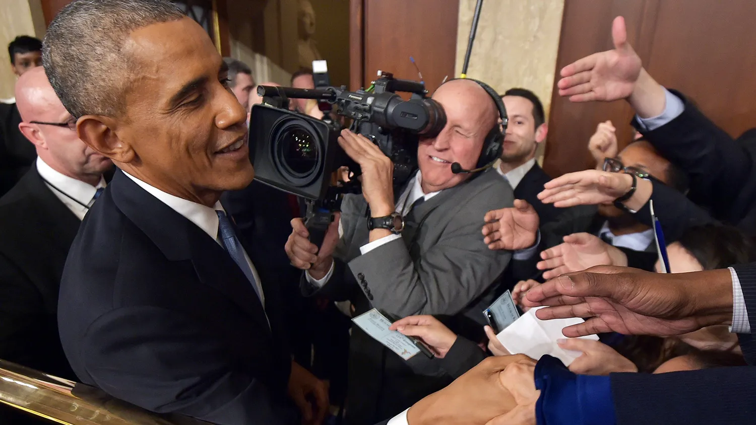 WASHINGTON, DC - JANUARY 20: U.S. President Barack Obama shakes hands after delivering the State of the Union address on January 20, 2015 in the House Chamber of the U.S. Capitol in Washington, DC. Obama was expected to lay out a broad agenda to address income inequality, making it easier for Americans to afford college education, and child care.
