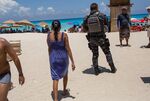 A Federal Police officer patrols a beach in Cancun, Mexico.