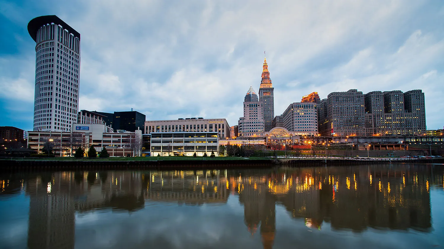 Buildings standing in the downtown skyline are reflected in the Cuyahoga River in Cleveland, Ohio, on April 12, 2014.
