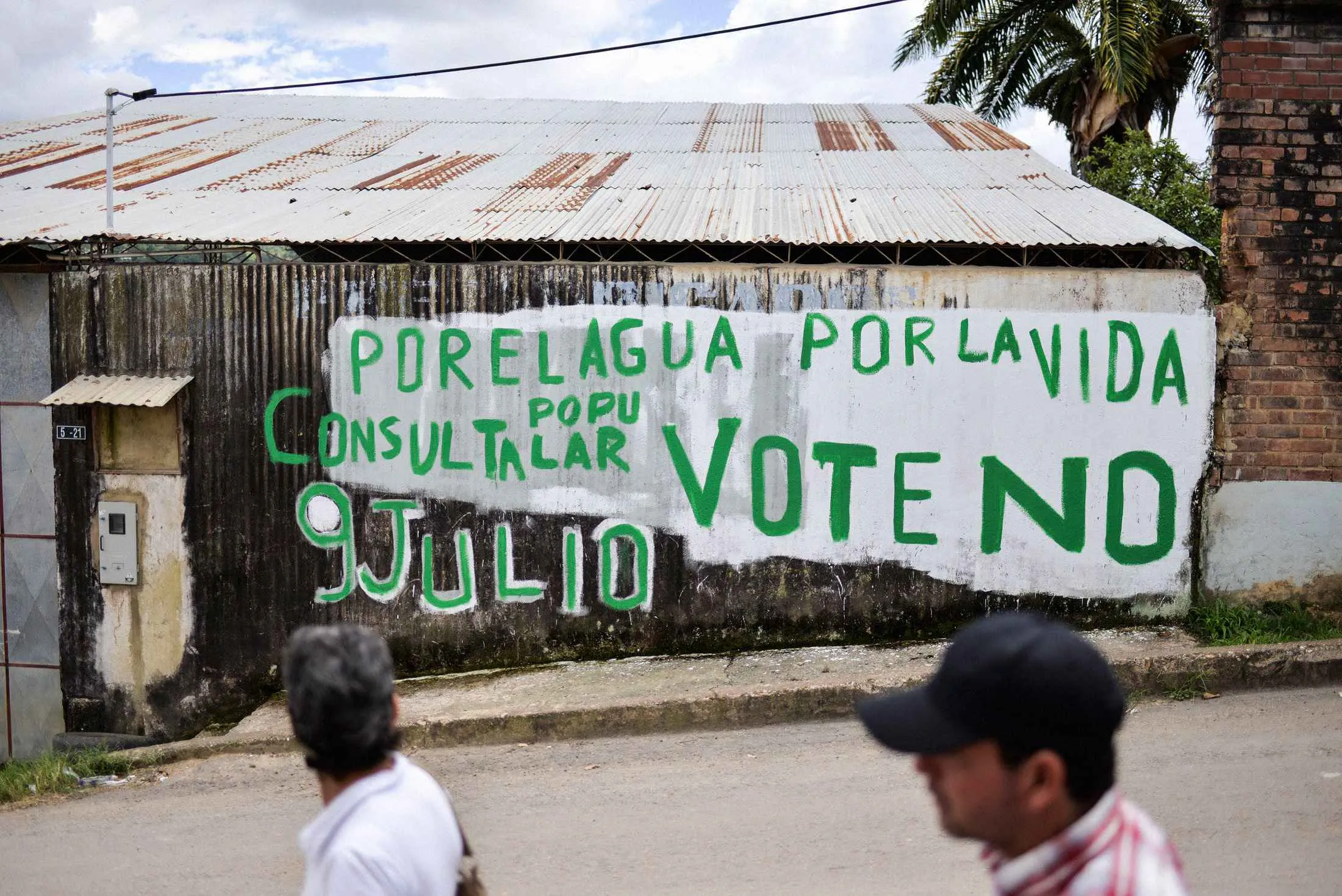 Graffiti in Arbeláez, Colombia, encourages locals to vote against an oil project to protect the environment.