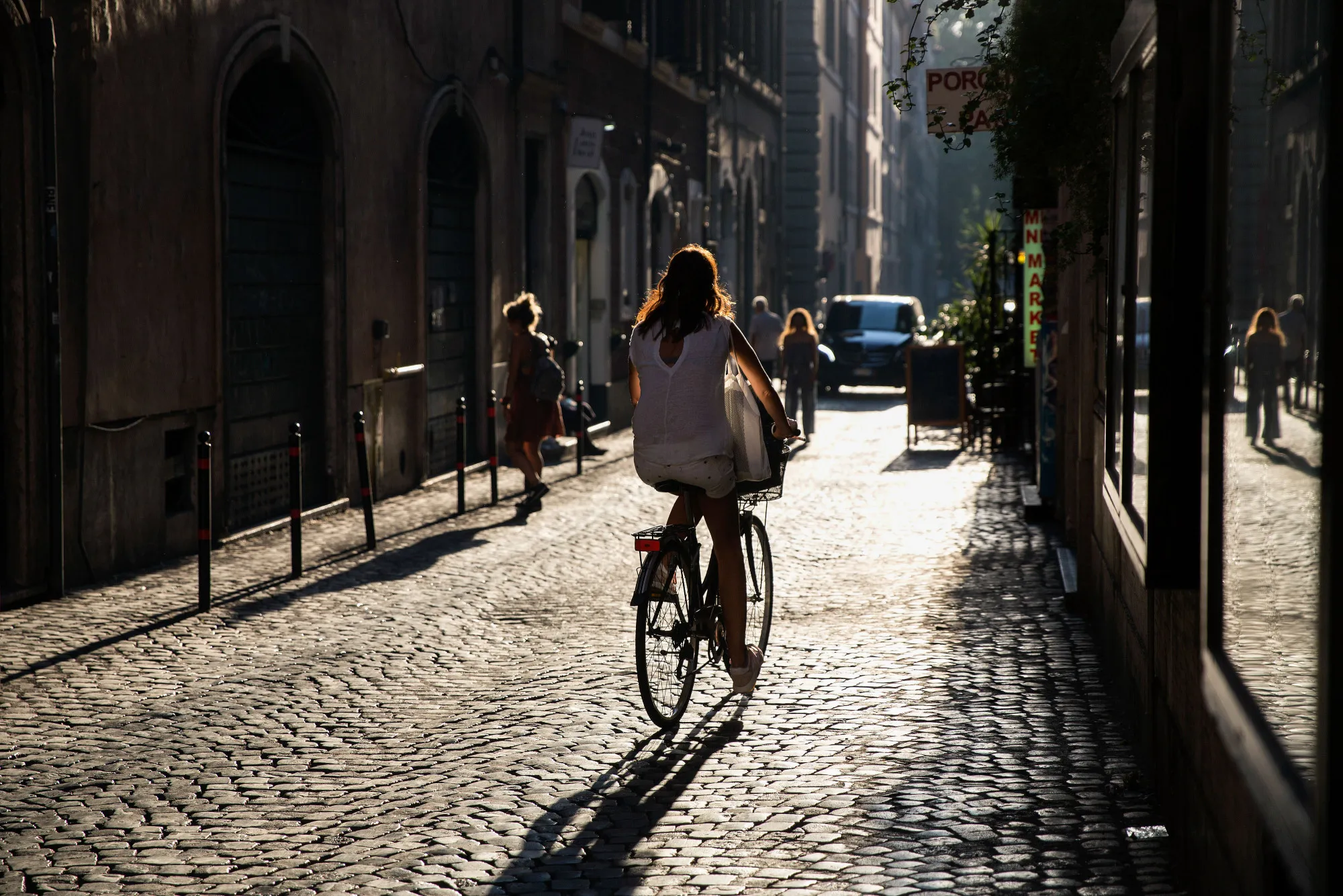 A cyclist rides a bicycle on a cobbled street in Rome, Italy, on Thursday, Aug. 17, 2017. Italy's economic recovery extended for a tenth straight quarter, boosting optimism that growth can become sustainable this year amid a rise in industrial production.