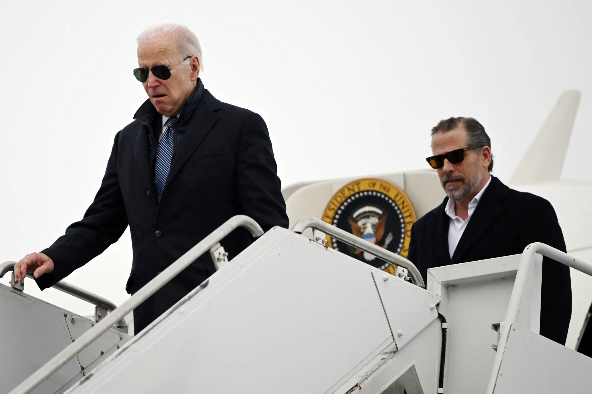 President Joe Biden, left, and Hunter Biden, arrive at Hancock Field Air National Guard Base in Syracuse, New York, on Feb. 4.