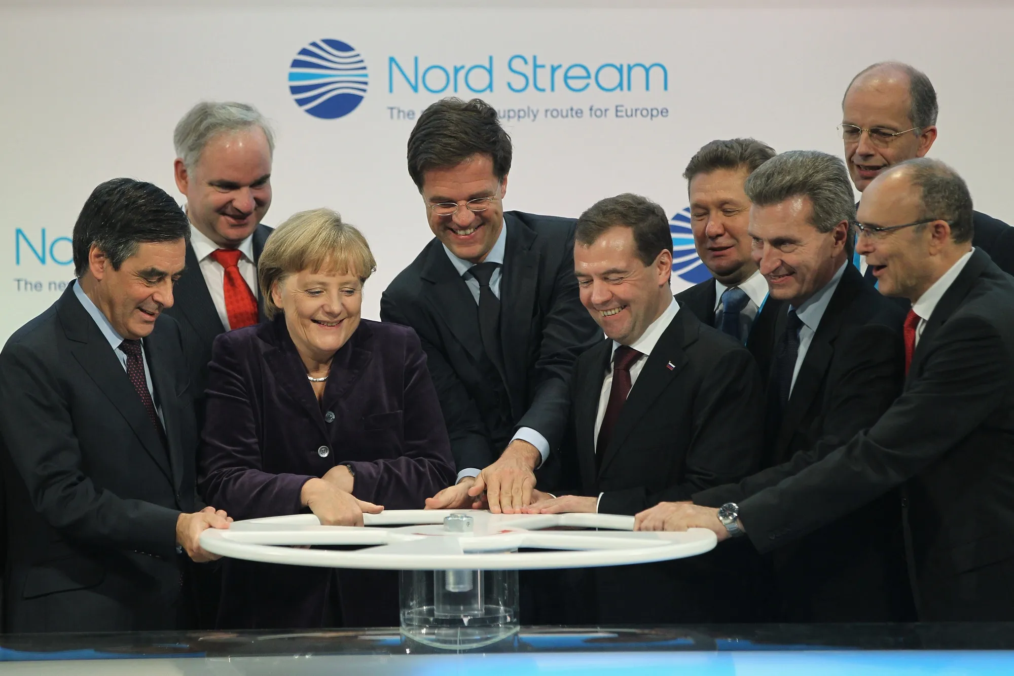 German Chancellor Angela Merkel and other European leaders&nbsp;turn a wheel with Russian President Dmitry Medvedev&nbsp;to symbolically start the flow of gas through the Nord Stream gas pipeline in 2011.