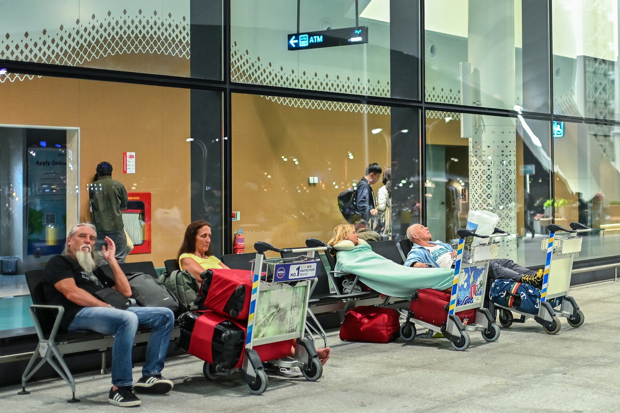 Stranded passengers wait at the Velana International Airport in Male on March 1, 2026 after the cancellation of several flights destined for the Middle East. Photographer: Mohamed Afrah