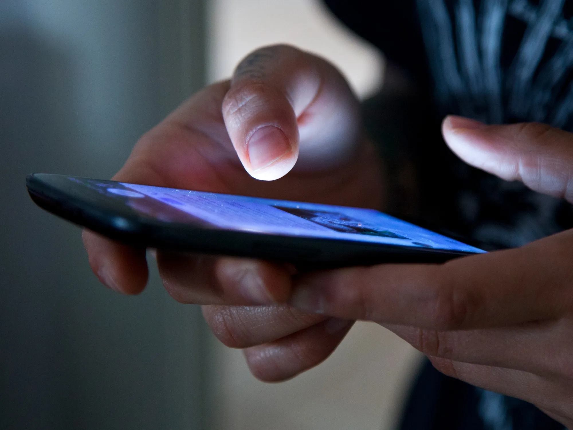 Hands holding smartphone