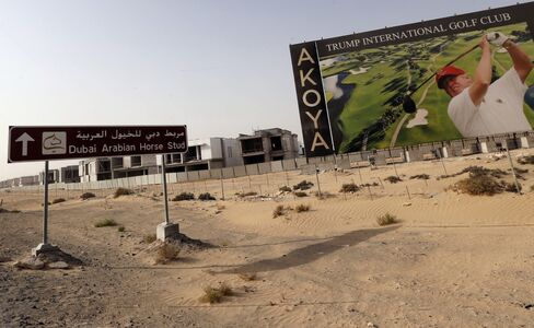 Donald Trump is shown playing golf on a billboard at the Trump International Golf Club Dubai on Aug. 12,