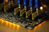 Blue data connector cables sit on a circuit board used in cryptocurrency mining machines at the SberBit mining 'hotel' in Moscow, Russia.