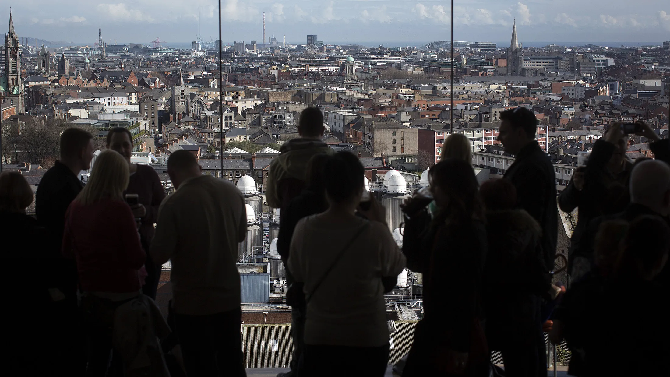 Visitors look out over the Dublin city skyline.