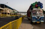 Oil barrels loaded on a truck in Faridabad, India.&nbsp;