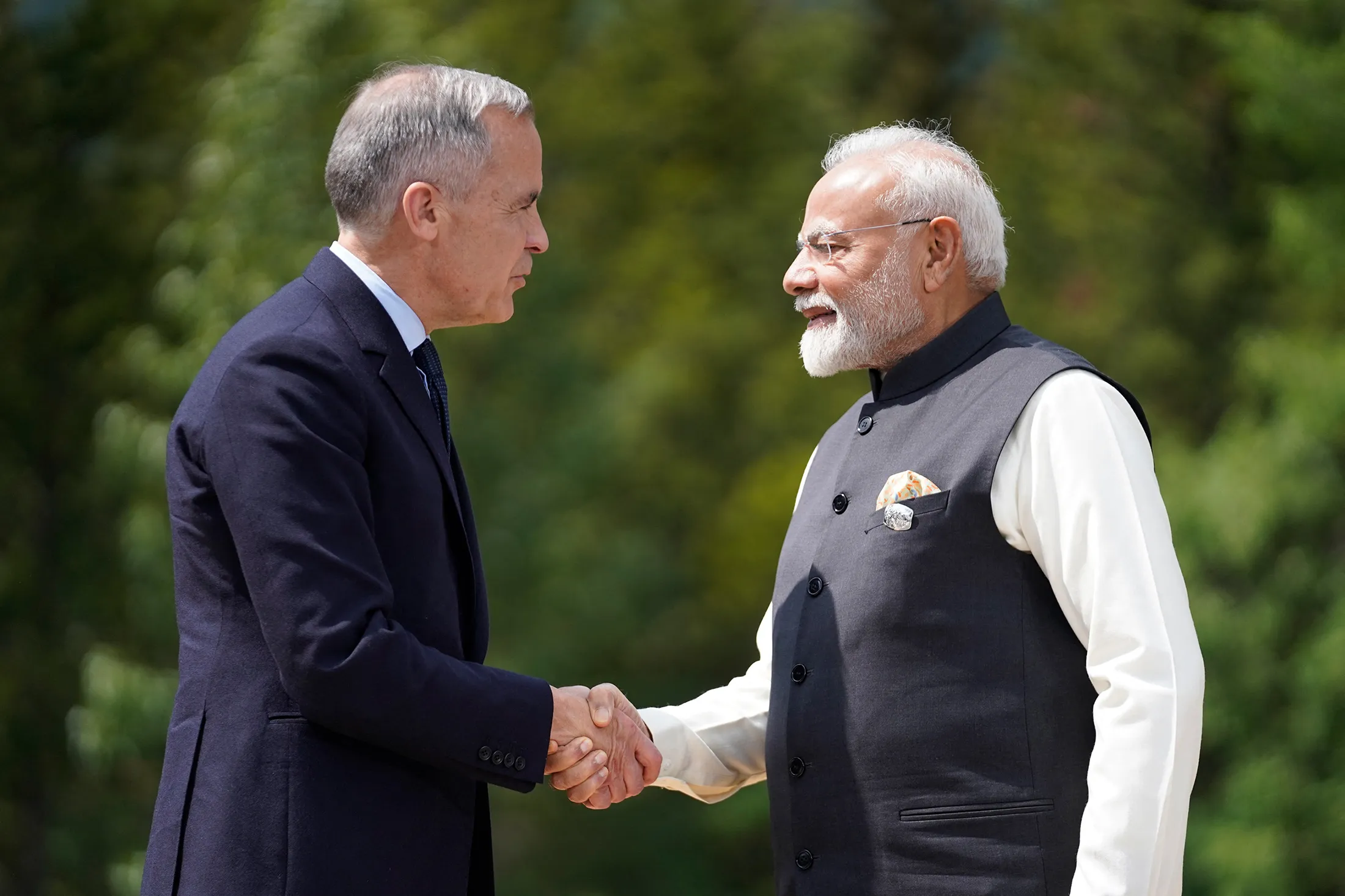 Prime Ministers&nbsp;Minister Mark Carney and Narendra Modi shake hands before a group photo during the Group of Seven (G7) Summit at the Pomeroy Kananaskis Mountain Lodge in Kananaskis, Alberta, Canada on June 17.