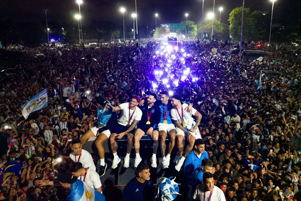 Lionel Messi holds the FIFA World Cup Trophy as he celebrates alongside teammates&nbsp;after winning the Qatar 2022 World Cup tournament in Ezeiza, Buenos Aires province, Argentina 2022.