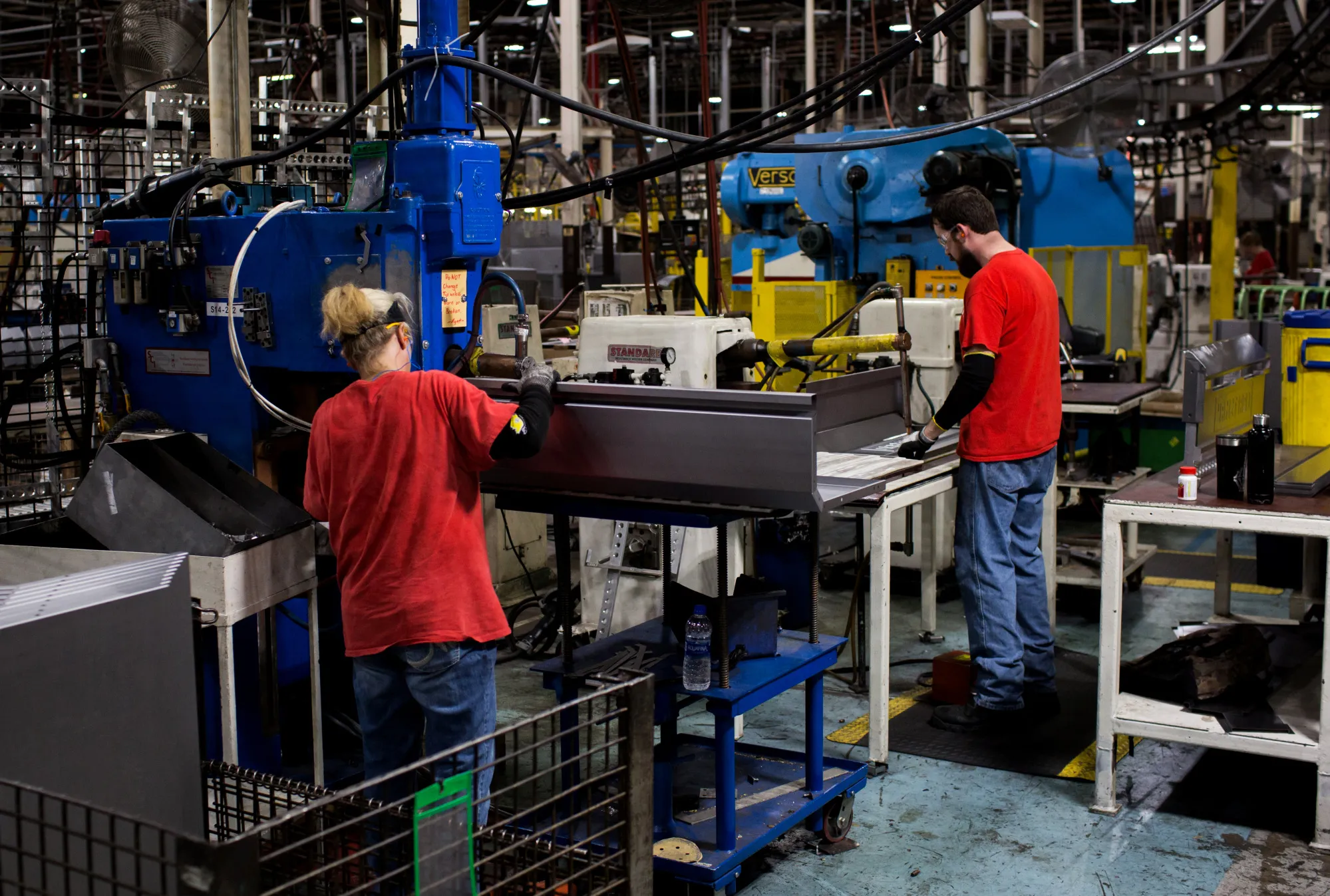 Workers assemble steel tool chests at a manufacturing facility in Sedalia, Missouri.