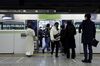 Passengers wearing protective face masks board and disembark from a Yamanote-line train, operated by East Japan Railway Co. (JR East), at a platform of Ikebukuro station in Tokyo, Japan, on Wednesday, Jan. 20, 2021. JR East has suspended a total of 42 trains on weekdays and 40 trains on weekend and holidays on the 11 lines, bringing forward the departure times of the last trains as much as 32 minutes to reduce late-night passenger number amid the spread of the coronavirus, according to the company.