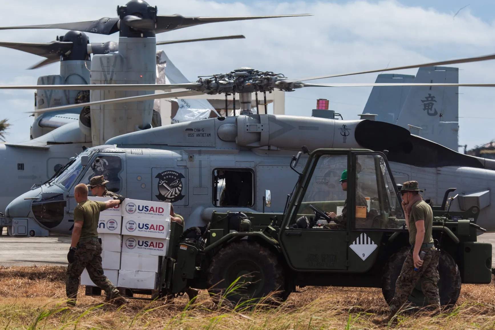 Members of the US Marine Corps move&nbsp;supplies from the U.S. Agency for International Development (USAID) at a loading zone in Guiuan, the Philippines.