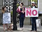 A Yes voter looks across at a supporter of the No campaign during a LoveBoth Stand Up For Life rally on May 12.