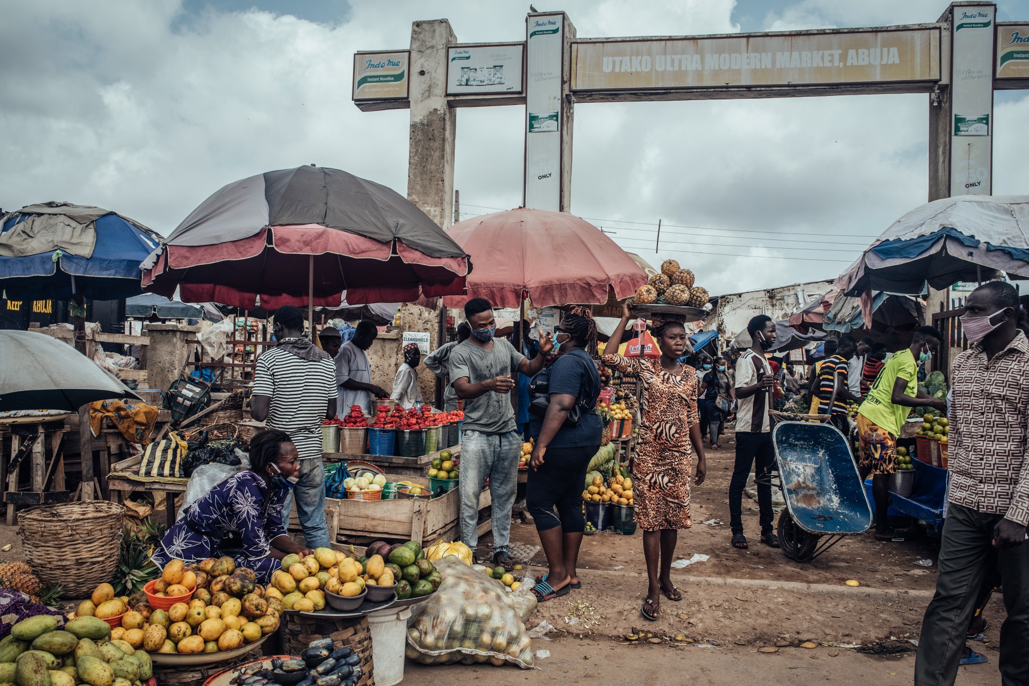 Vendors sell fresh produce at a market in Abuja.