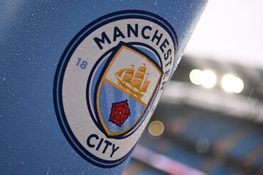 The Manchester City logo.