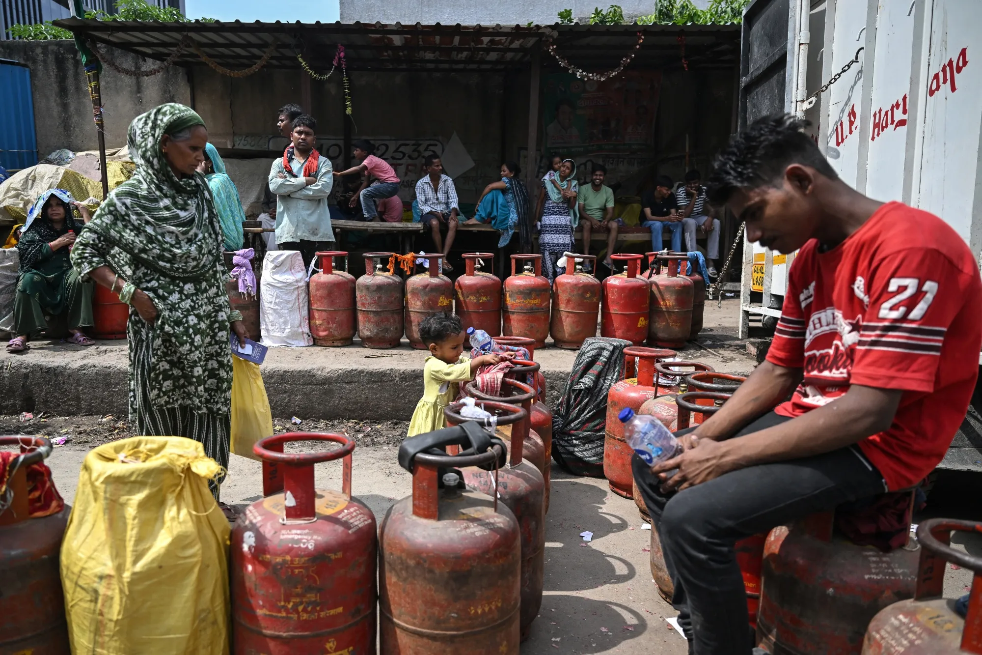 Residents buy LPG cylinders in Noida, India on April 2.