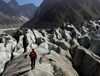 Photo of hiker walking alone on the expansive Mer de Glace in Chamonix
