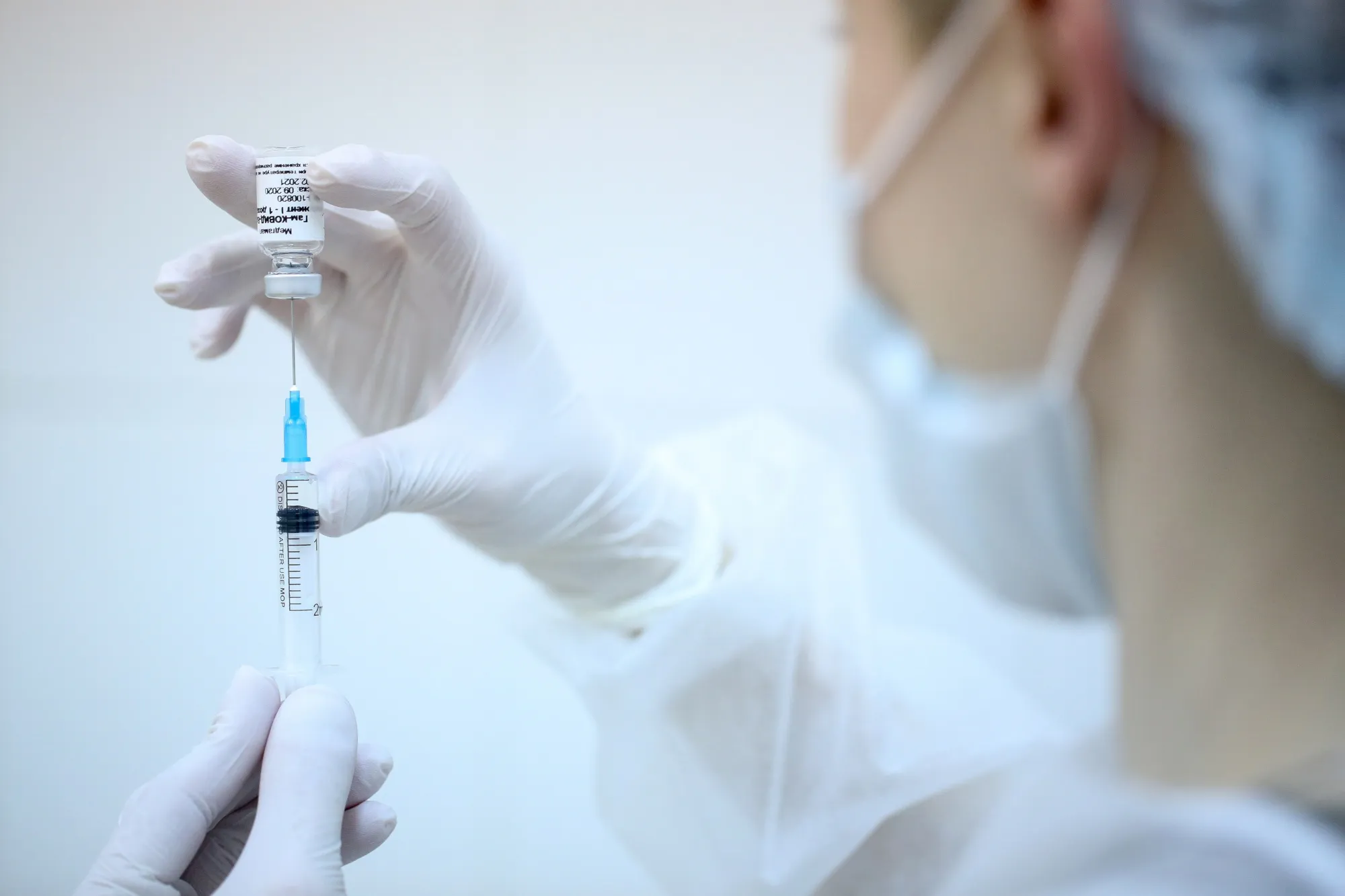A heath worker draws the 'Sputnik V' Covid-19 vaccine from a vial during a&nbsp;trial&nbsp;in Moscow.