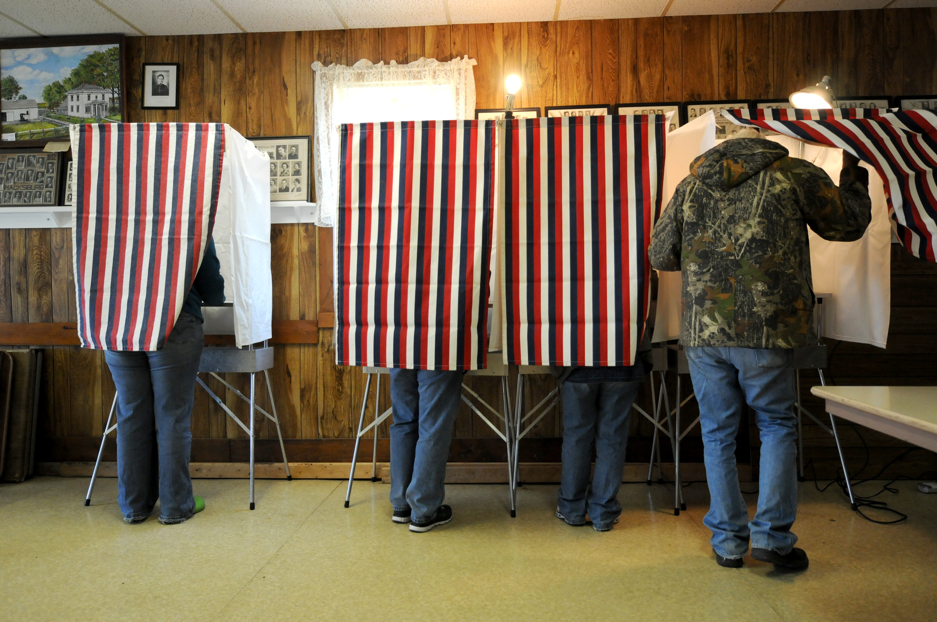 Voters cast their ballots at the WCR Hall November 6, 2012 in Macksburg, Iowa.
