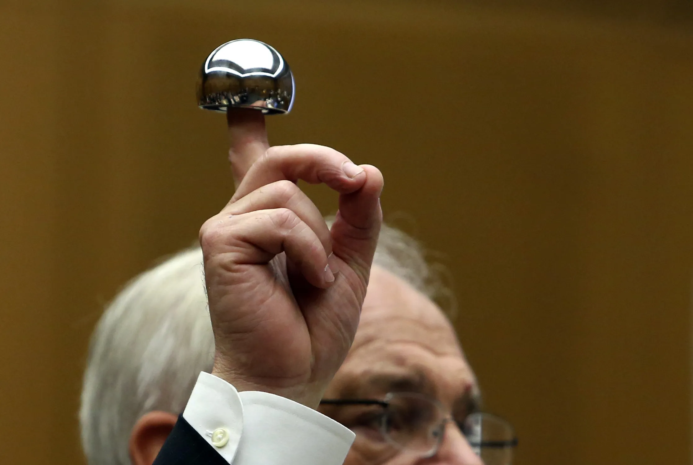An attorney holds up an ASR XL hip implant made by Johnson &amp; Johnson during trial at the California Superior Court in Los Angeles on Jan. 25, 2013.