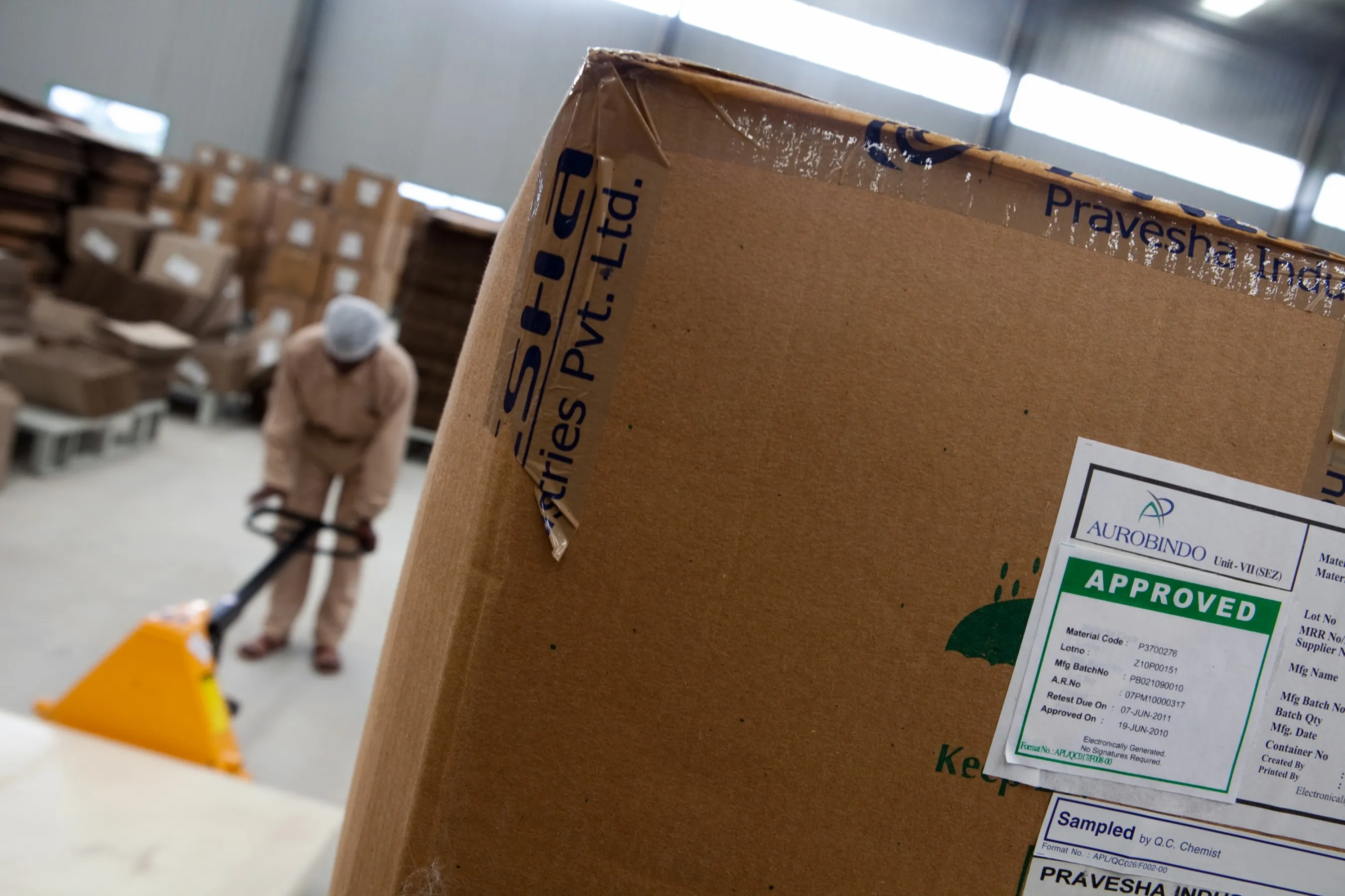 Employees work at an Aurobindo Pharma Ltd. production facility in Jadcherla, India.