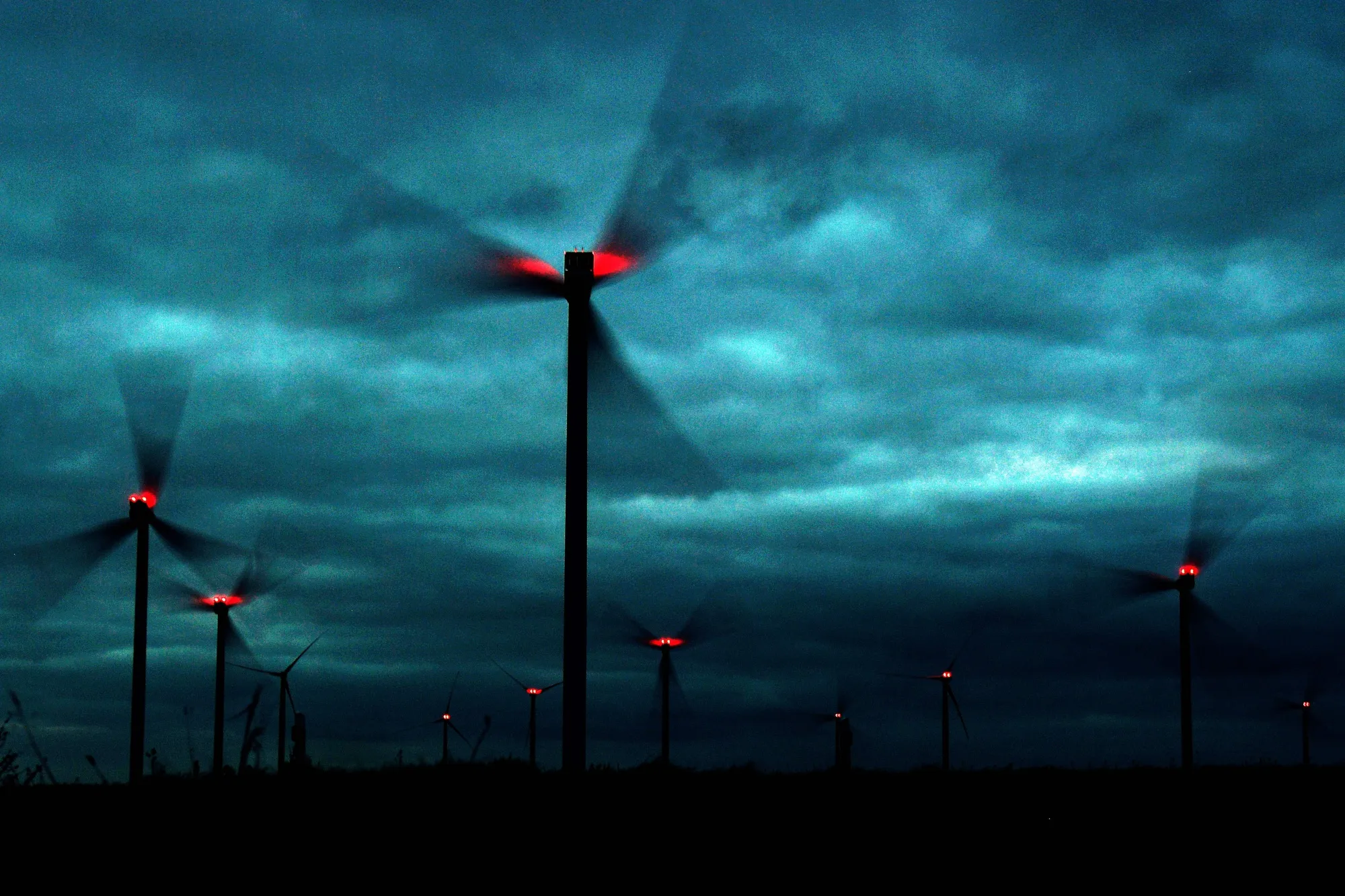 Cloudy skies, busy windmills.