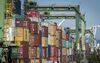 Shipping containers sit stacked at the Port of Oakland in Oakland, California, U.S., on Tuesday, July 17, 2018. The U.S. Census Bureau is scheduled to release trade balance figures on August 3.
