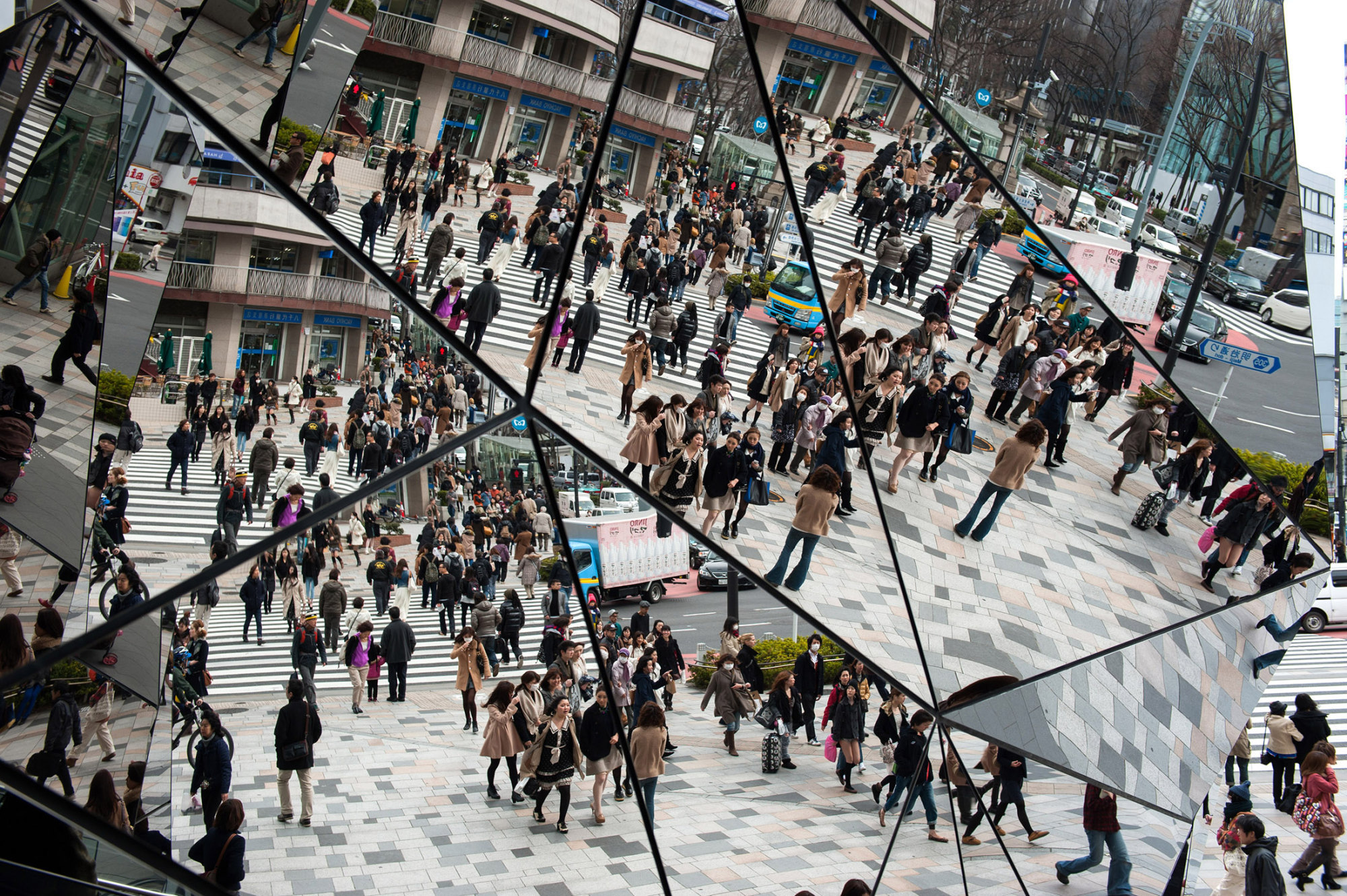 People walks on the shopping district in Omotesando, Japan, on Friday, March. 1, 2013. Photographer:Noriko Hayashi
